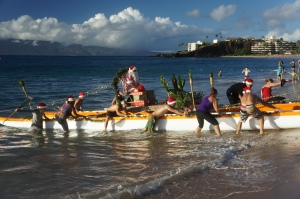 Santa makes landfall in Kaanapali Maui by canoe